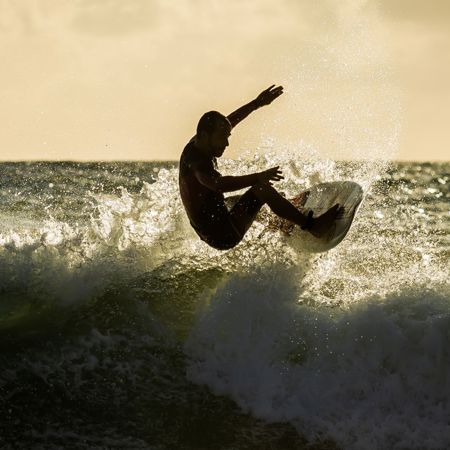 Person enjoying surfing